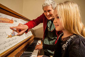 Young piano lesson pupil